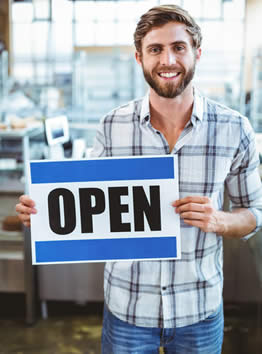 male cafe owner open for business